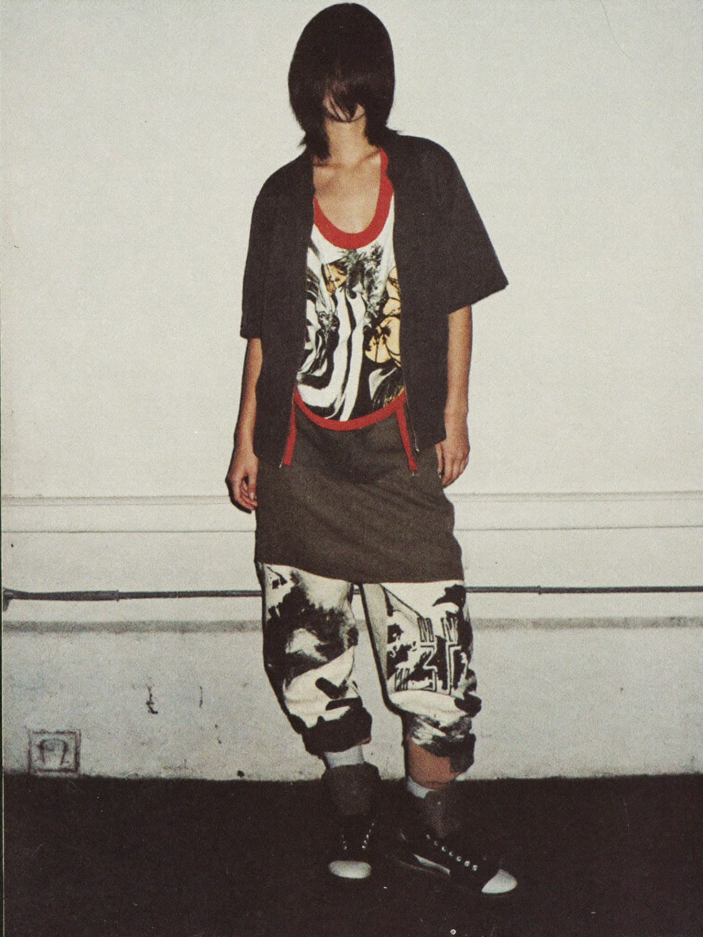Street portrait: workwear layered over printed fabric